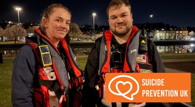 a man and woman in life jackets